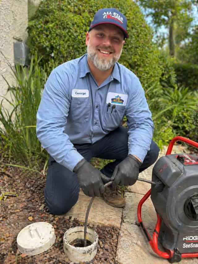 All Star Plumbing & Air's George rooting a drain line.